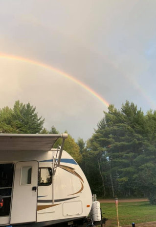 rainbow over camper